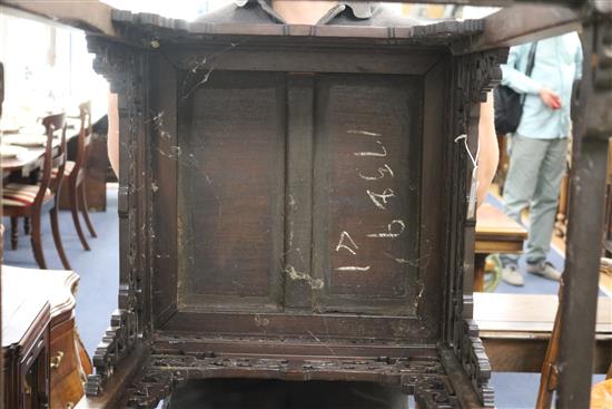 A Chinese huali wood urn stand, having panelled top and pierced frieze W.52cm